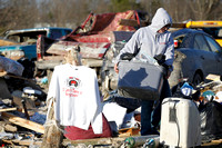 A shirt proclaiming "I can't take it anymore" hangs amid the debris of homes where several people died in tornado destruction in East Bernstadt, Kentucky